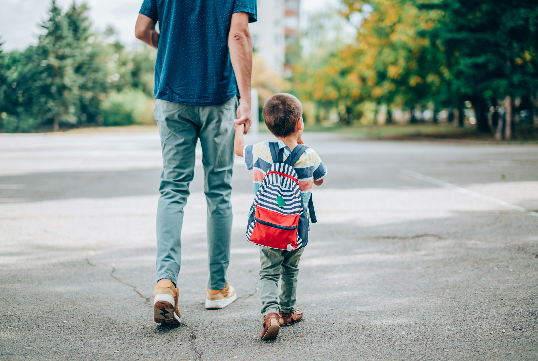 Father and son going to kindergarten.