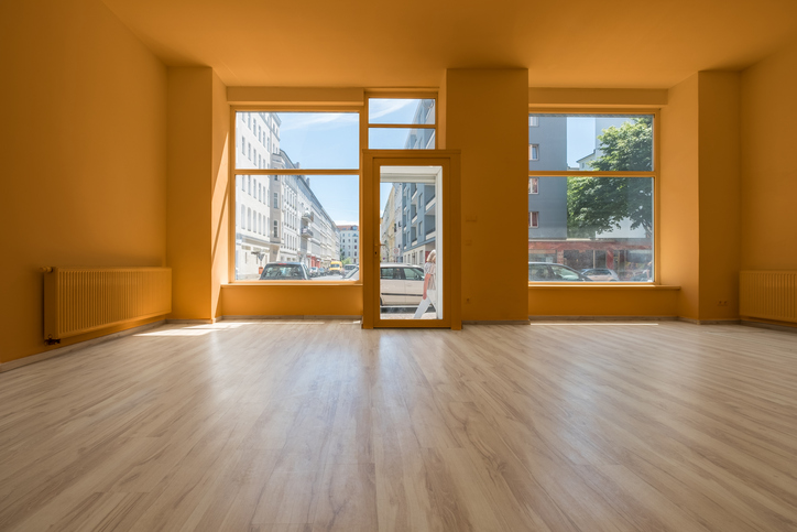 renovated store / shop - empty room with wooden floor and shopping window